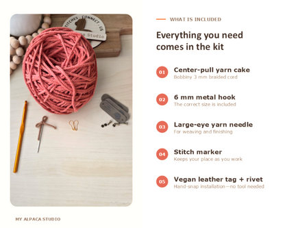 A product kit overview graphic from My Alpaca Studio showing a pink yarn cake, metal hook, yarn needle, stitch marker, and vegan leather tag on a light wood surface next to an included items list.